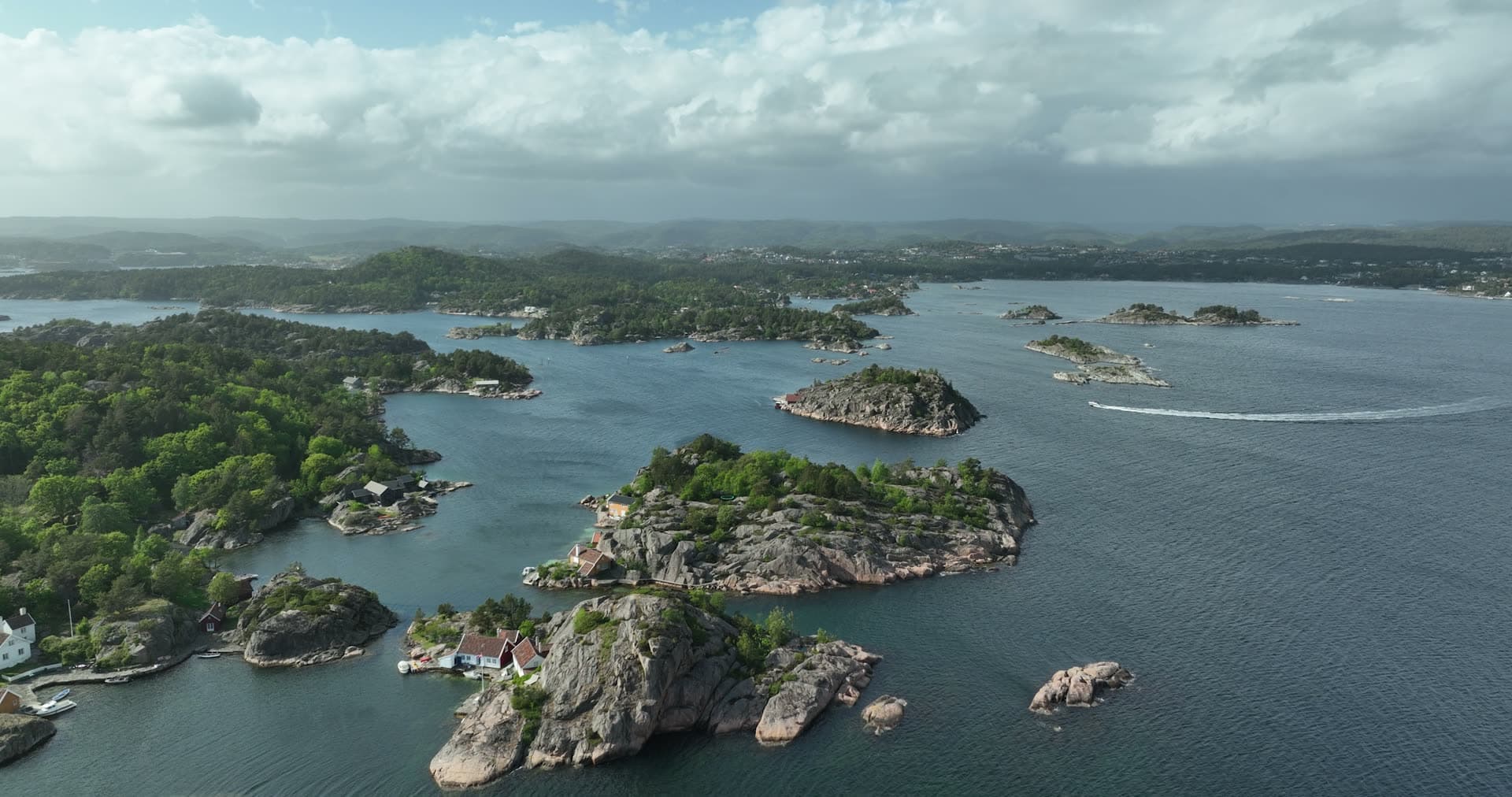 Scattered granite islands dotting sheltered bay, Ny-Hellesund, Norway