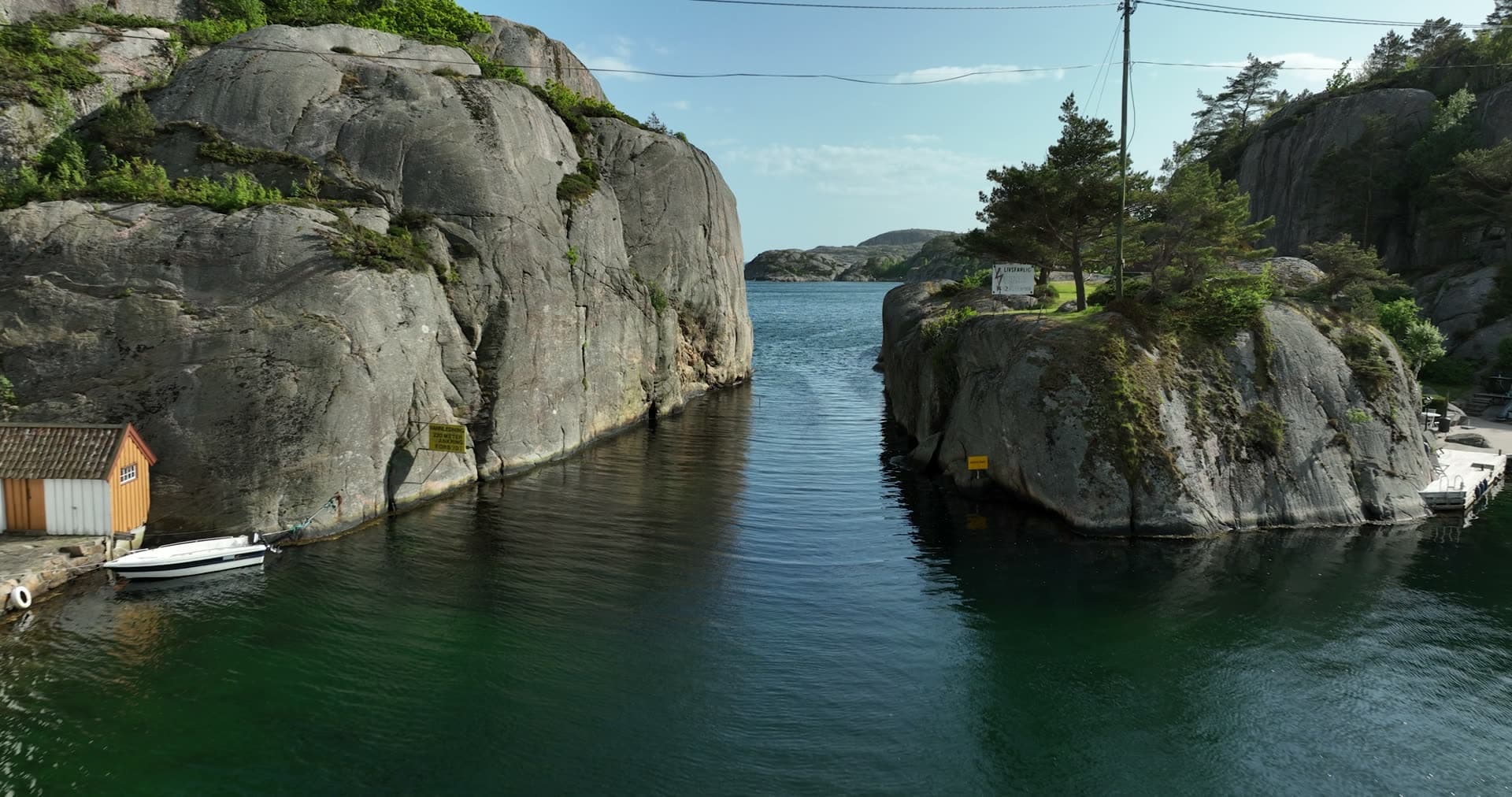 Narrow waterway between towering granite cliffs, Ny-Hellesund, Norway