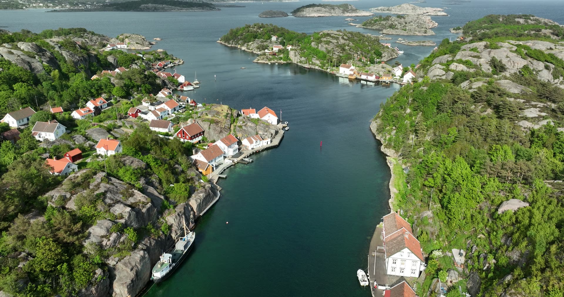 Narrow channel separating two rocky peninsulas, Ny-Hellesund, Norway