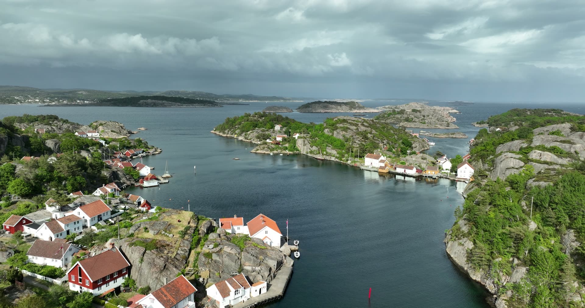 Overcast sky and dramatic granite formations, Ny-Hellesund, Norway