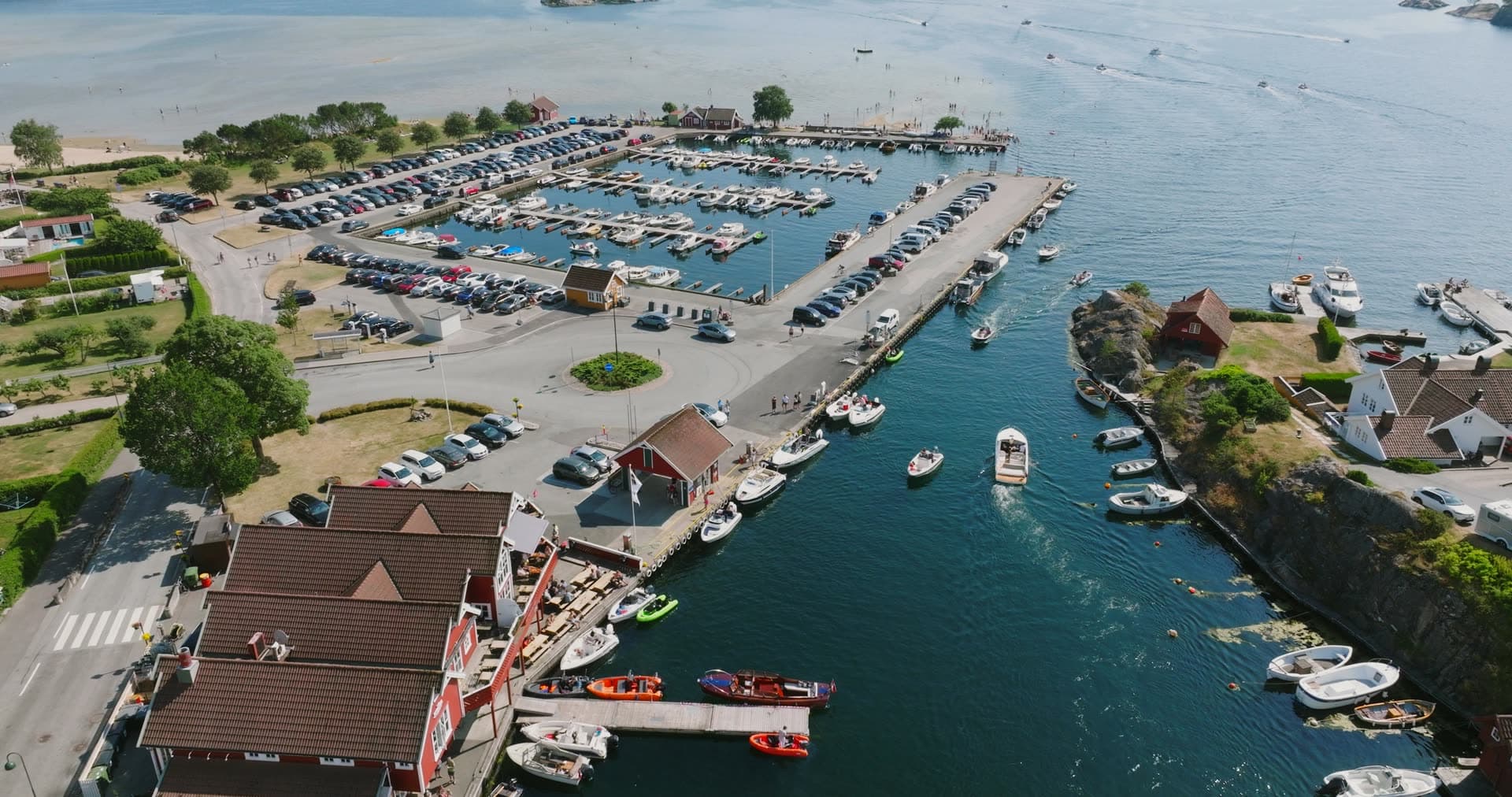 Large marina parking lot and crowded boat basin, Høllen, Norway