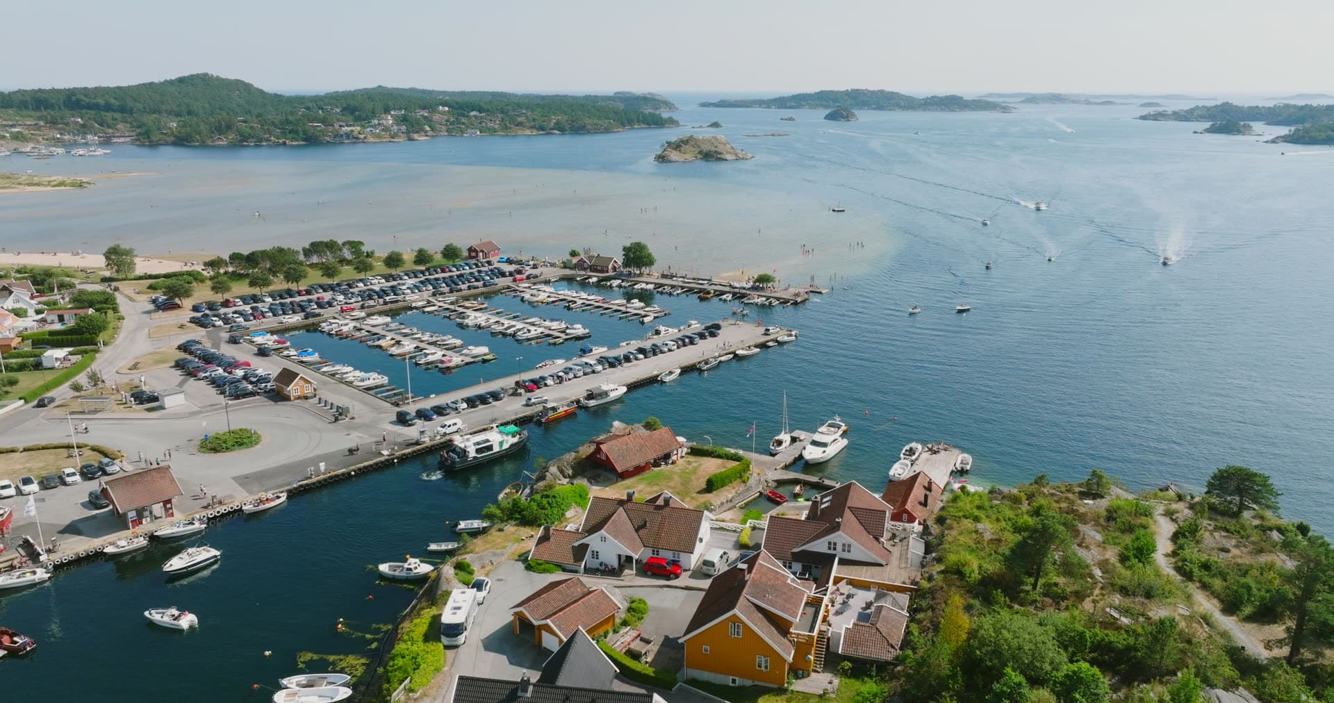 Waterfront homes overlook crowded marina basin, Høllen, Norway