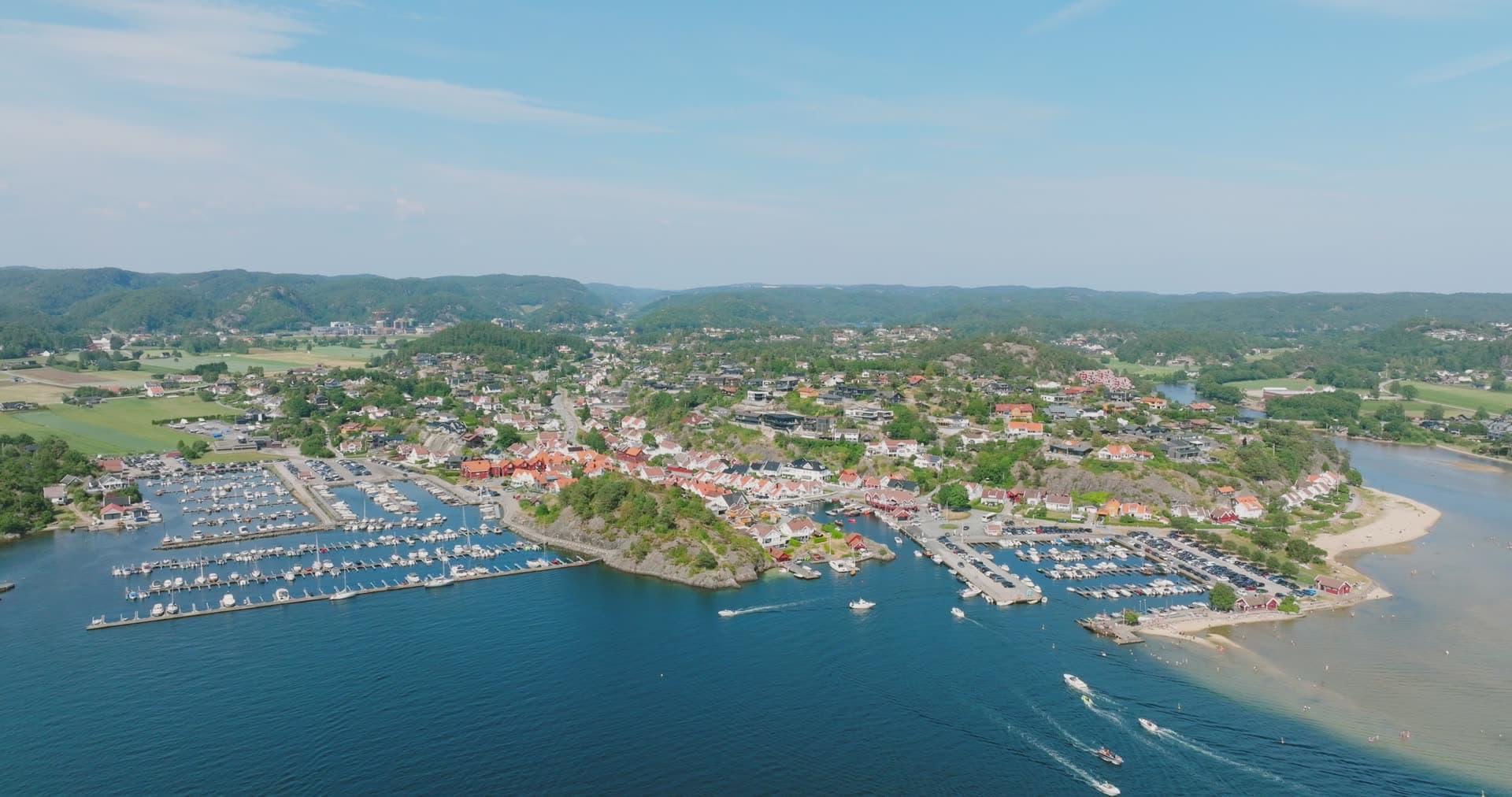 Marina fleet and hillside town sprawl, Høllen, Norway