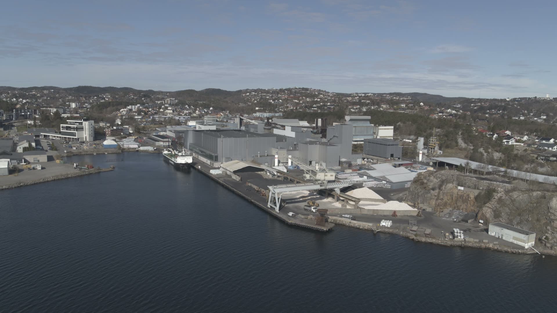 Shipyard with docked vessel and industrial cranes, Kristiansand, Norway