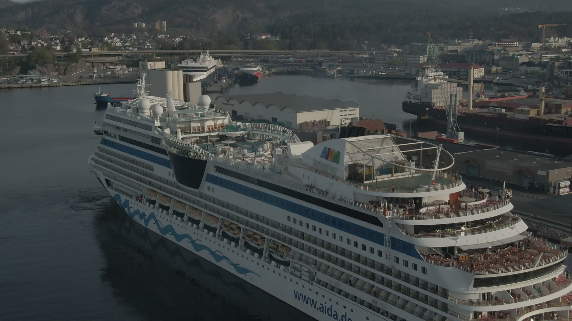 Large cruise ship docked at industrial port, Kristiansand, Norway