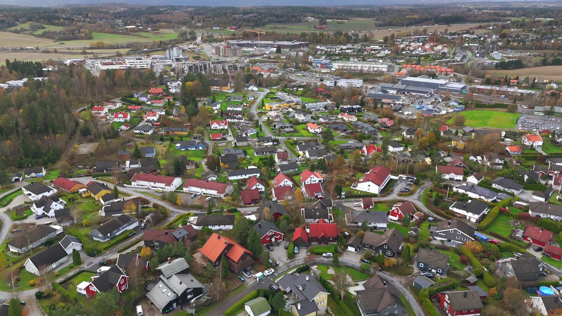 Red-roofed farmhouses dotting rural landscape, Sole skog, Norway