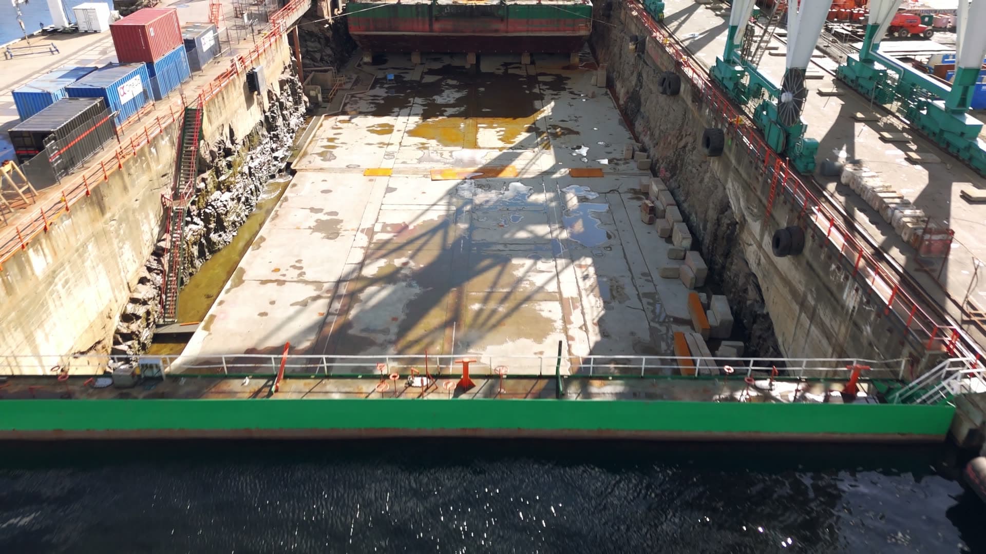 Ship drydock with flooded basin and overhead cranes, Kristiansand, Norway