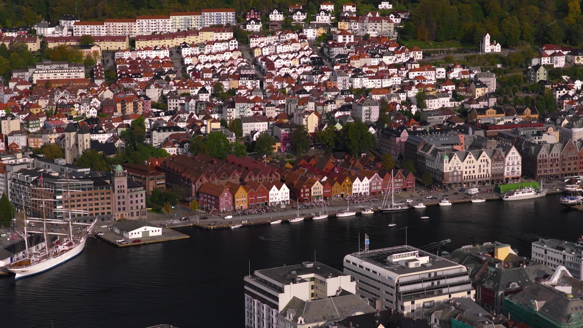 Waterfront promenade with moored sailboats and historic gabled houses, Bryggen, Bergen, Norway