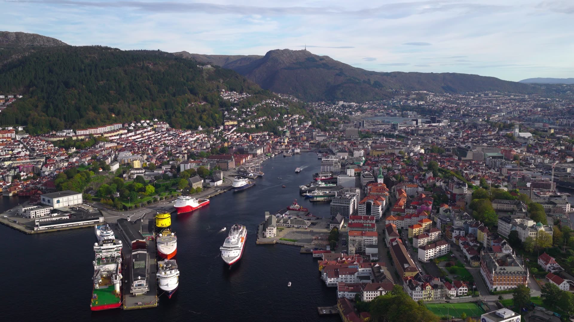 Large vessels docked at busy commercial port, Bryggen, Bergen, Norway
