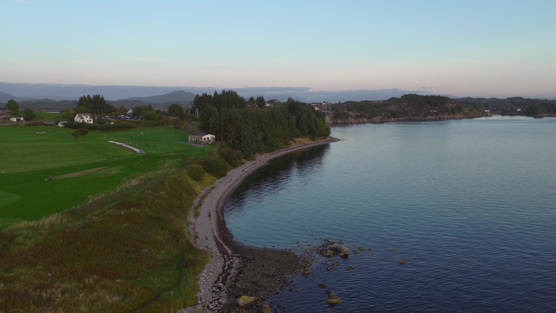 Rocky coastal bay with rural farmland, Herdla