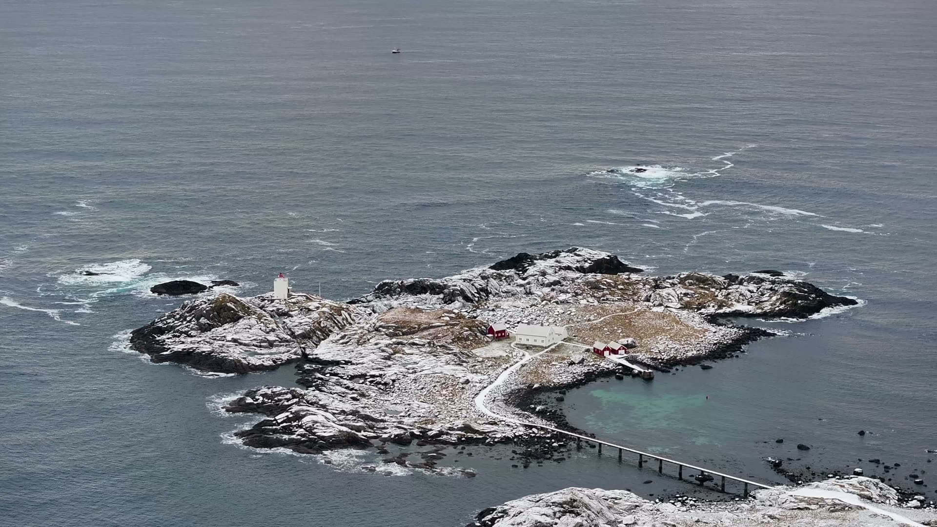 Overhead aerial view of snowy Ulla lighthouse island