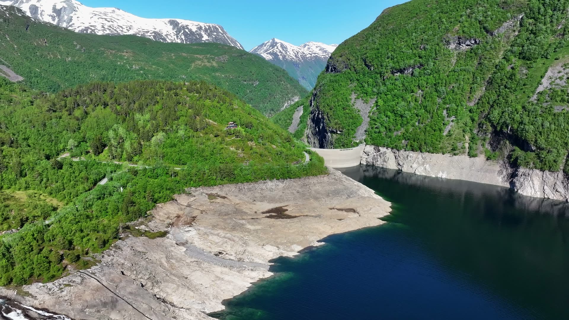 Low water level and exposed reservoir banks at Zakariasdammen, Tafjord