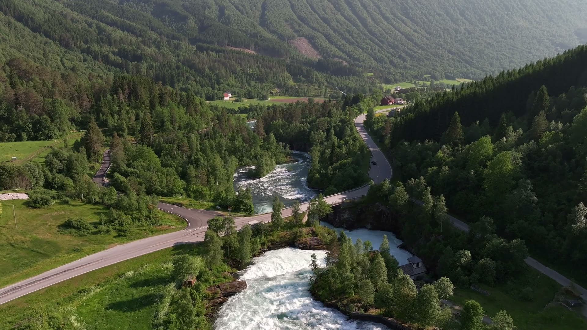 River rapids and farmland along Valldal in Norway
