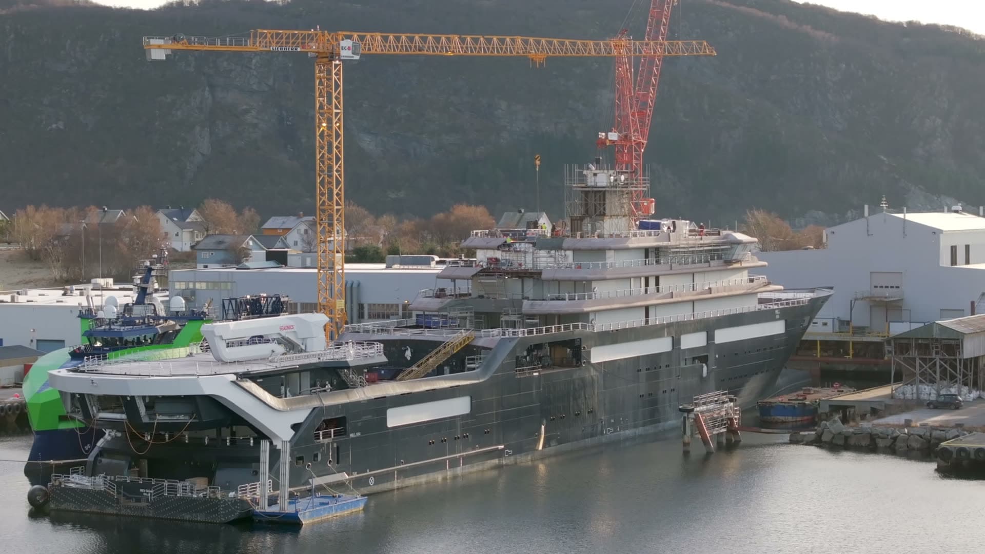 Close rear quarter view of REV Ocean beside the shipyard quay