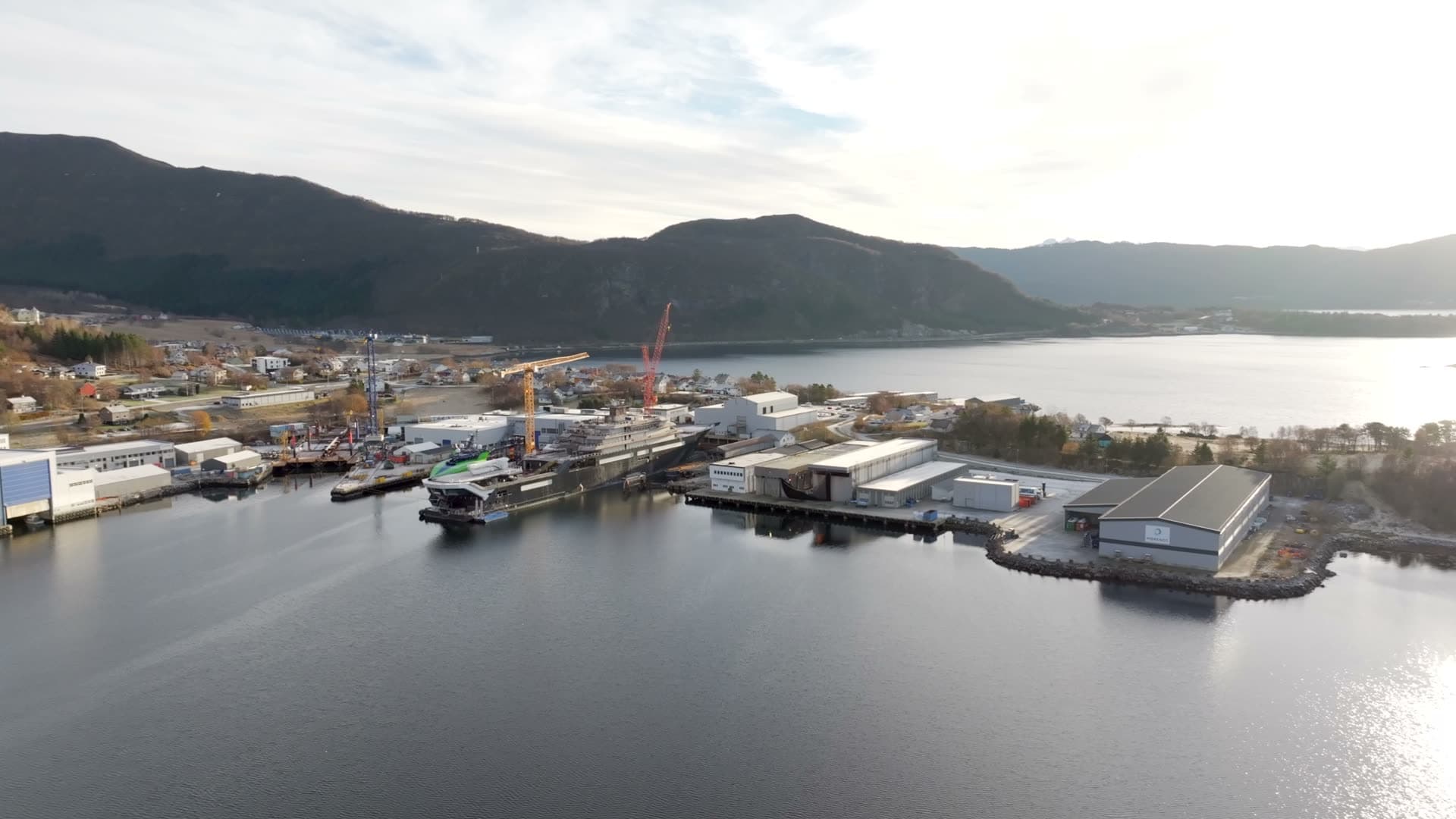 Wide aerial panorama of Vard Søviknes shipyard and the fjord