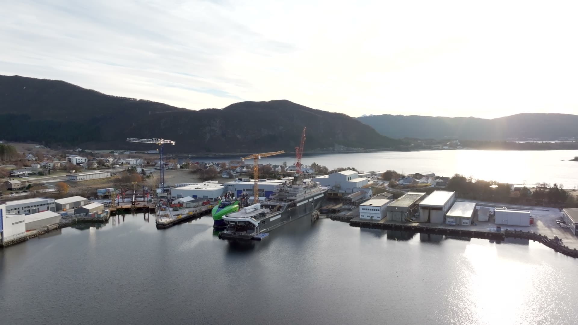 Wide rear aerial view of REV Ocean and the Søvik waterfront