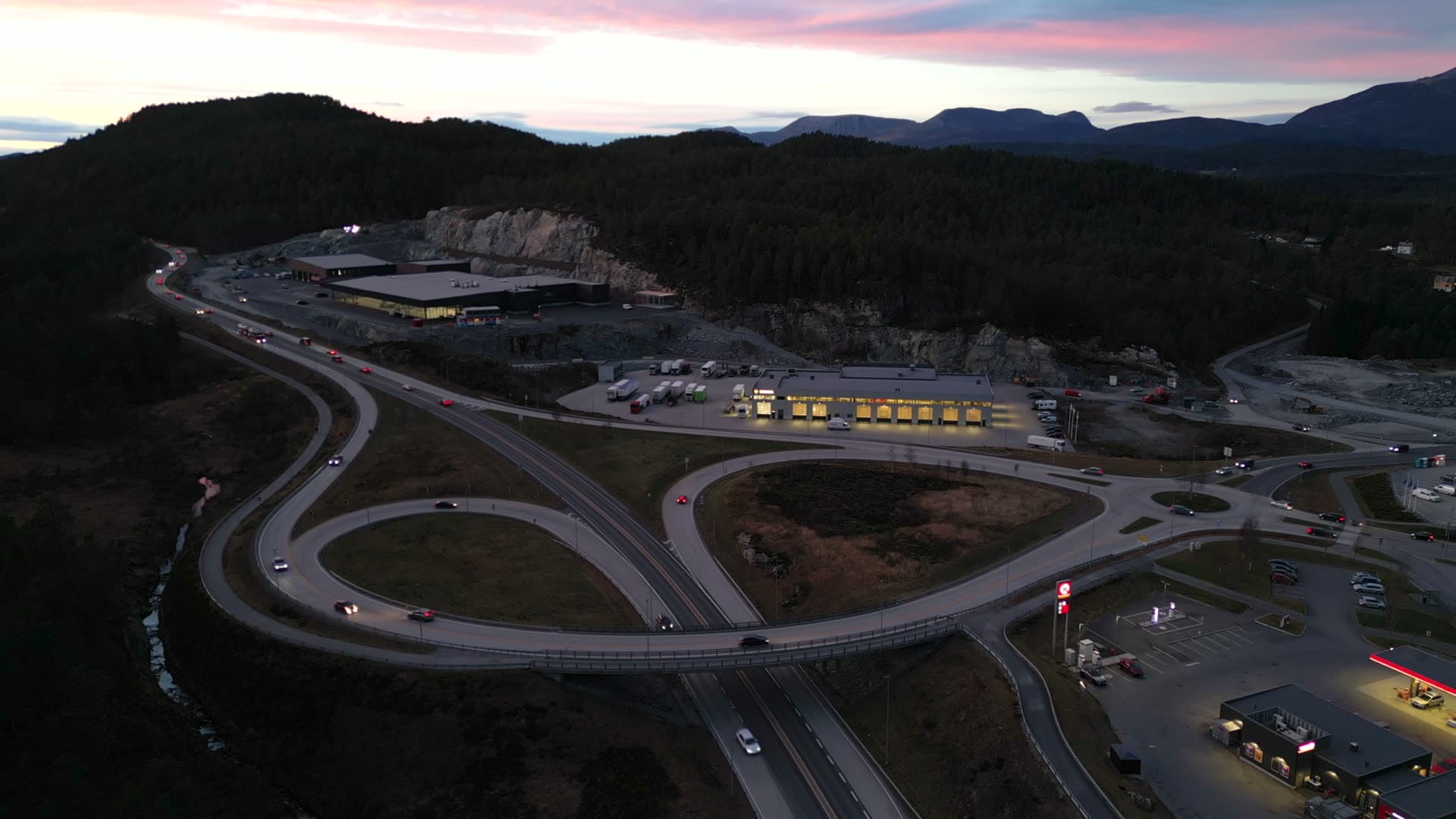 Wide view of Digernes roads and business buildings at sunset