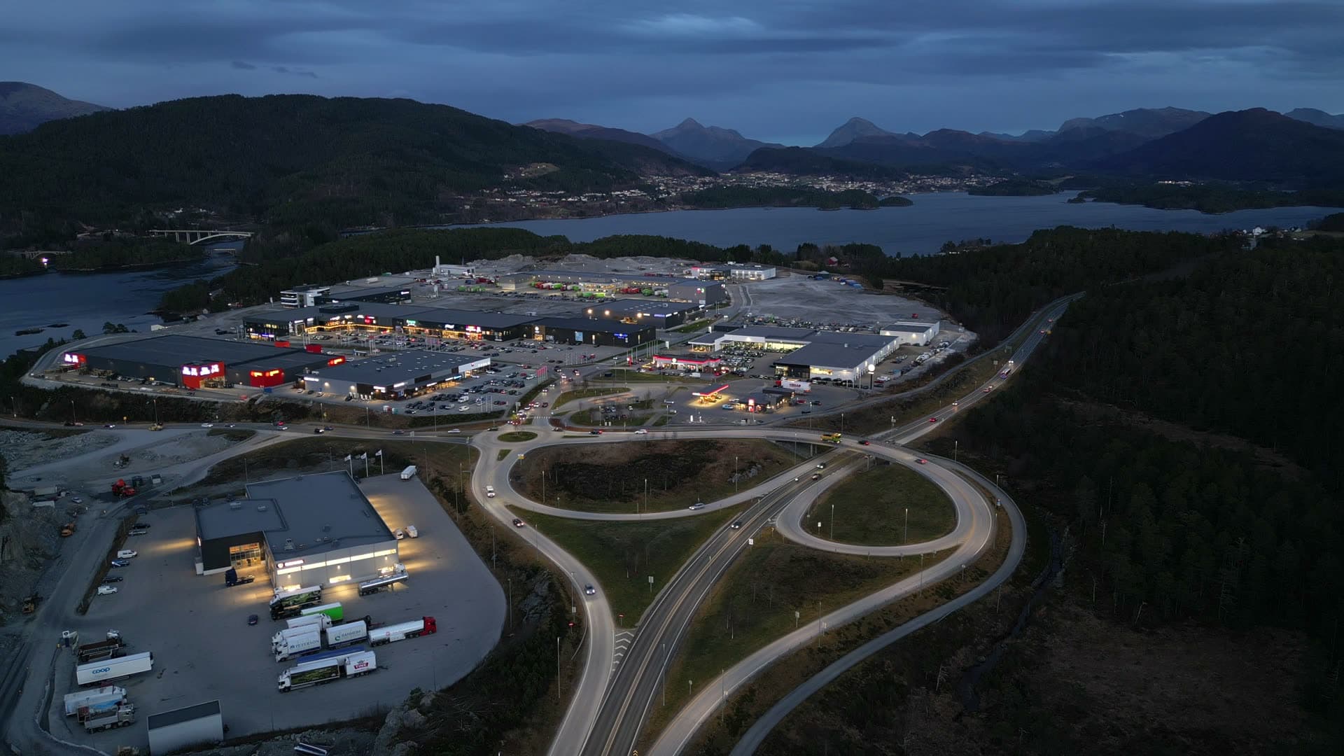 Illuminated Digernes shopping area and roads at dusk