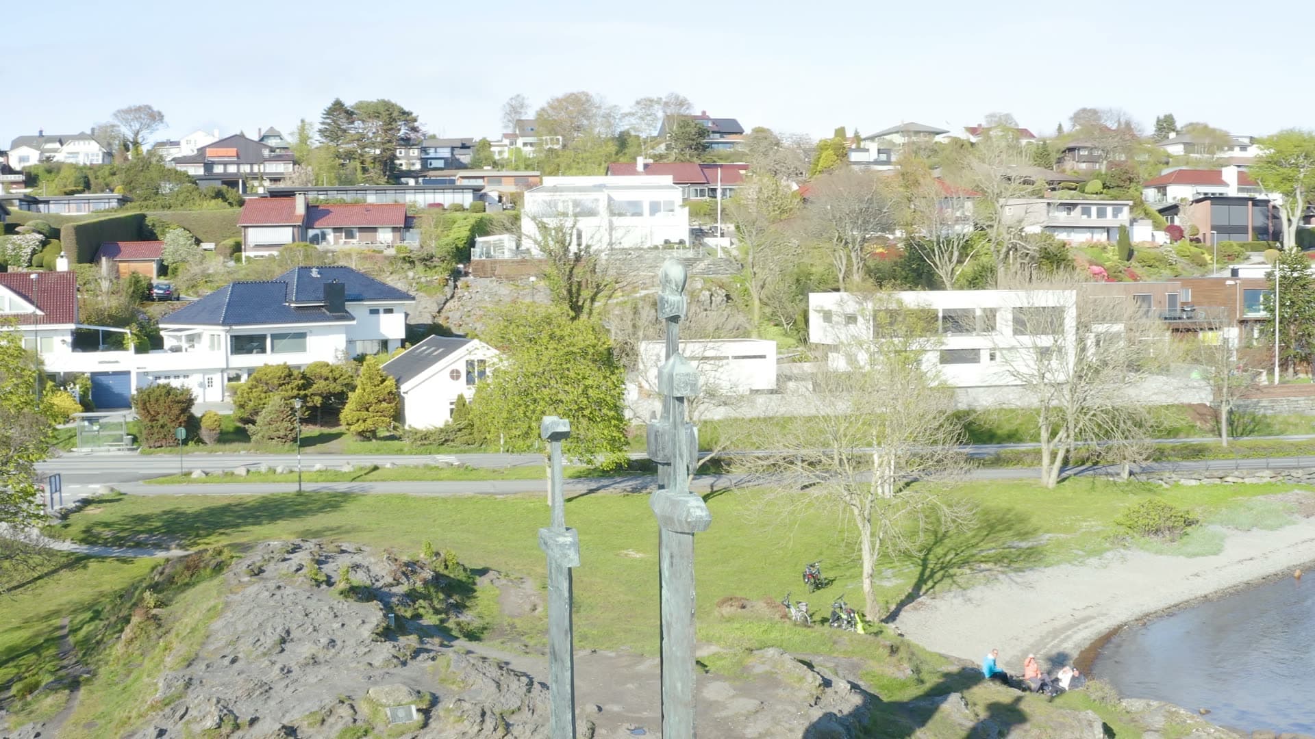 Three Swords in stone overlooking coastal town, Sverd i fjell