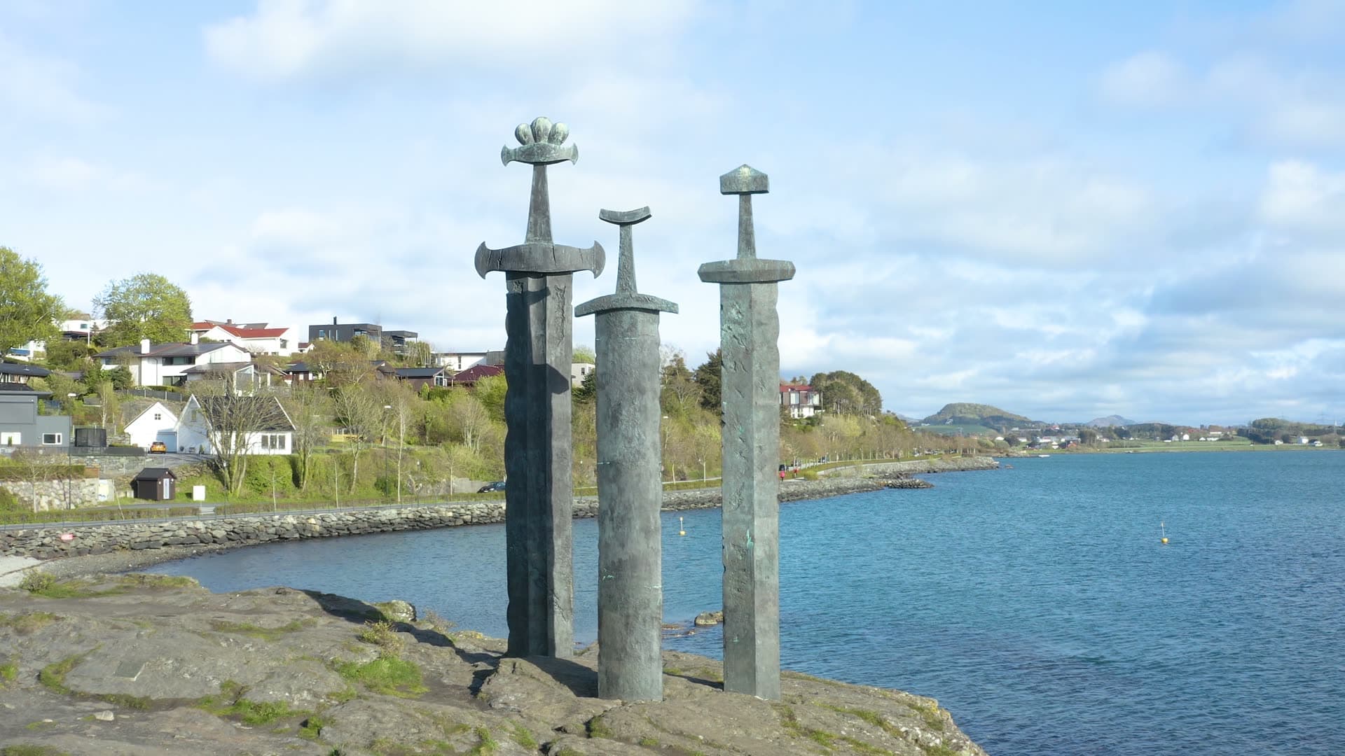 Three Swords in stone crosses by fjord, Sverd i fjell