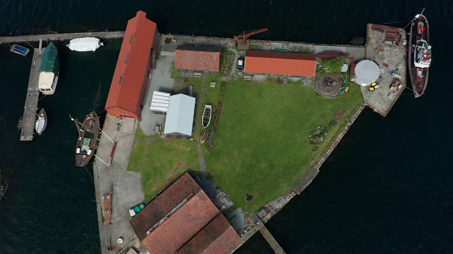 Coastal fishing village with boathouse and moored boats, Stavanger