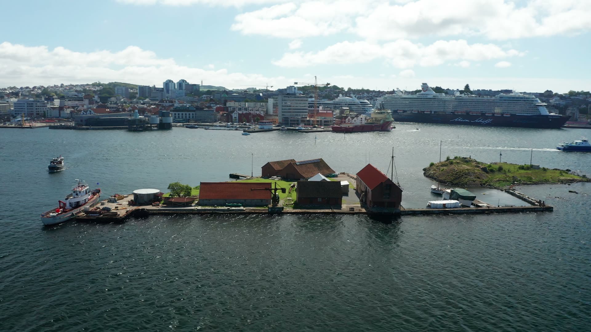 Red-roofed island dock and moored vessels, Stavanger
