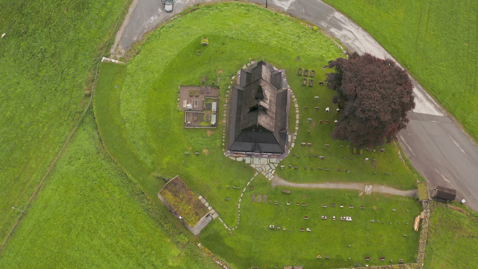 Rural stone church with graveyard, Hopperstad stavkirke