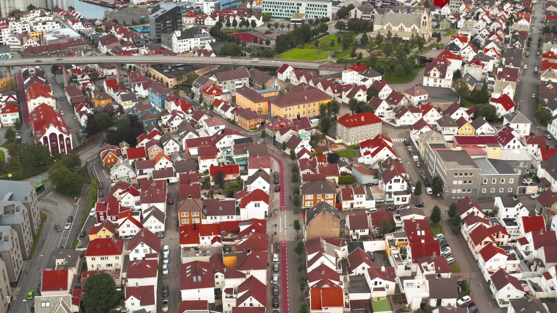 Residential neighborhood with red roofs and harbor, Stavanger