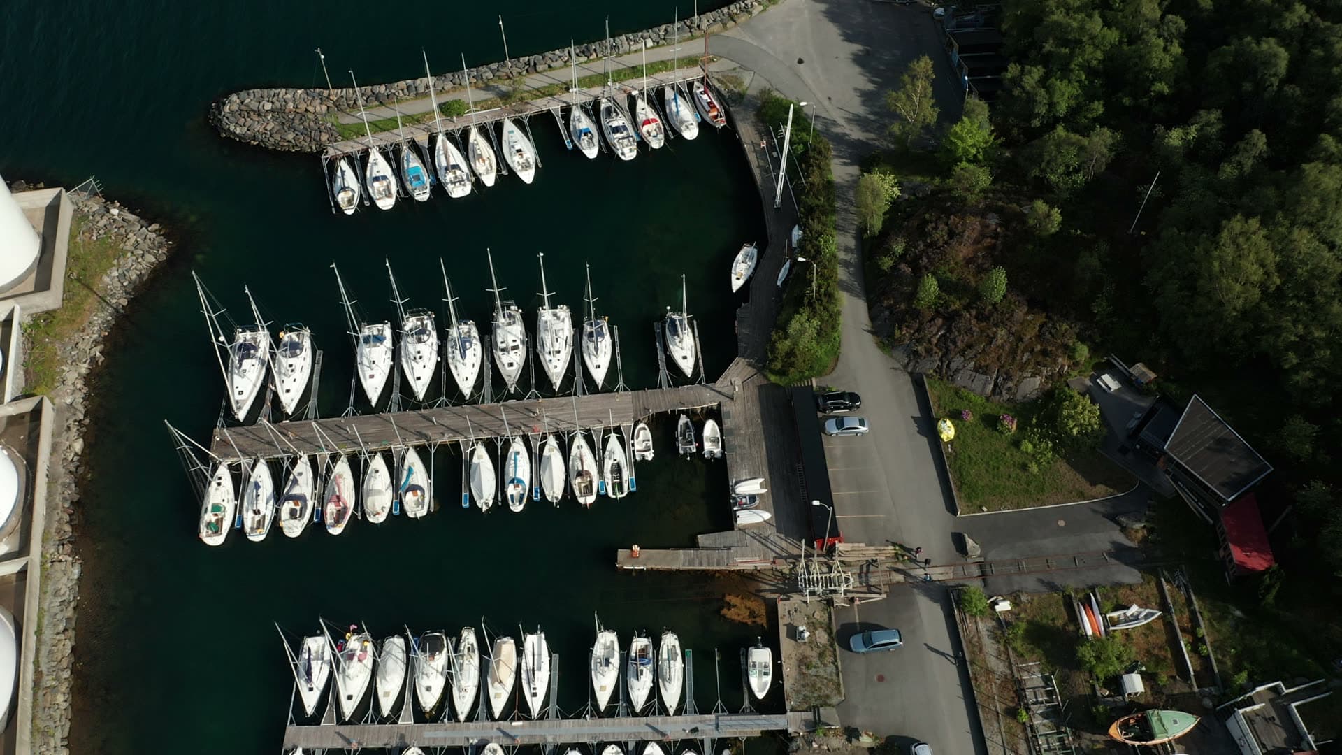Sailboat fleet moored in coastal marina, Lervig