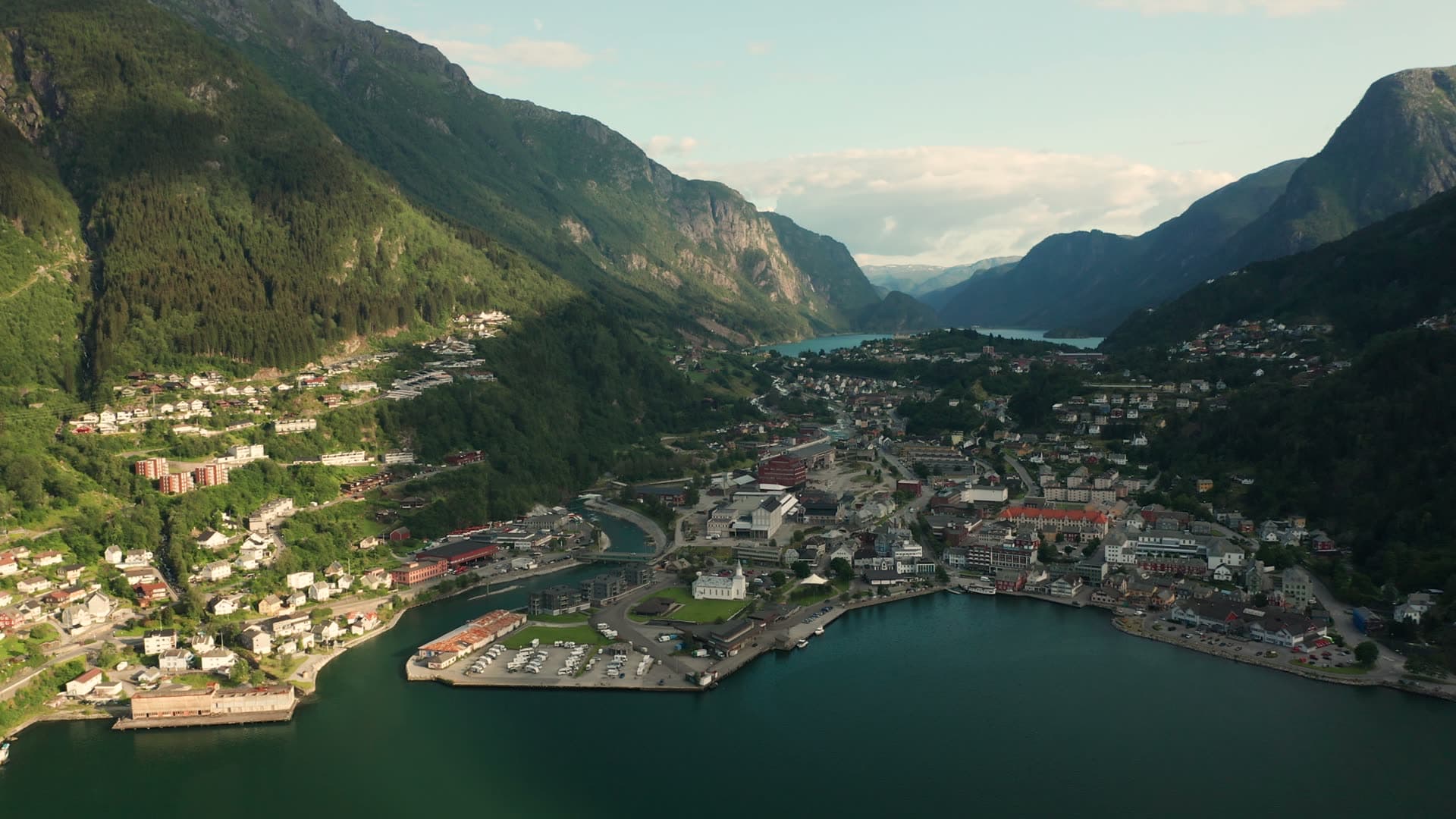 Alpine valley town with turquoise lake, Odda