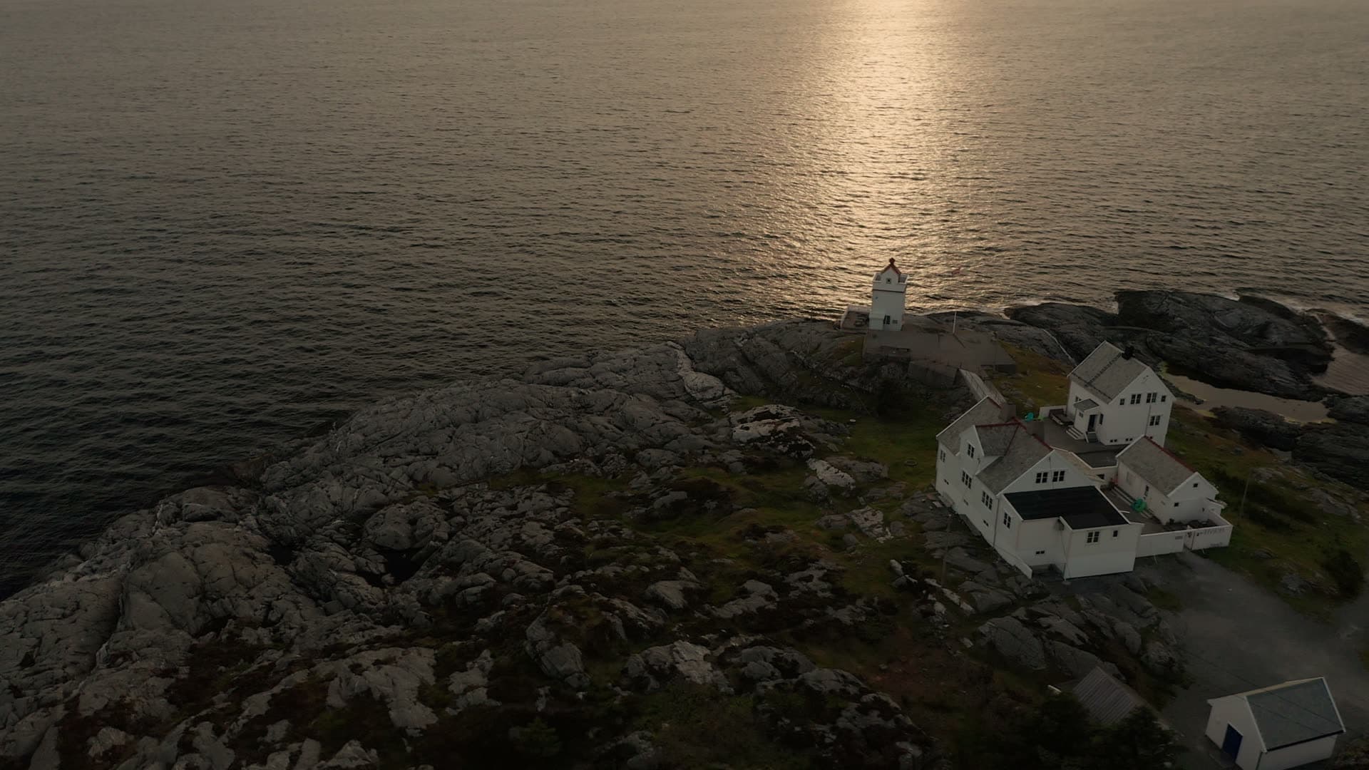 White house on rocky coastal headland, Ryvarden fyr