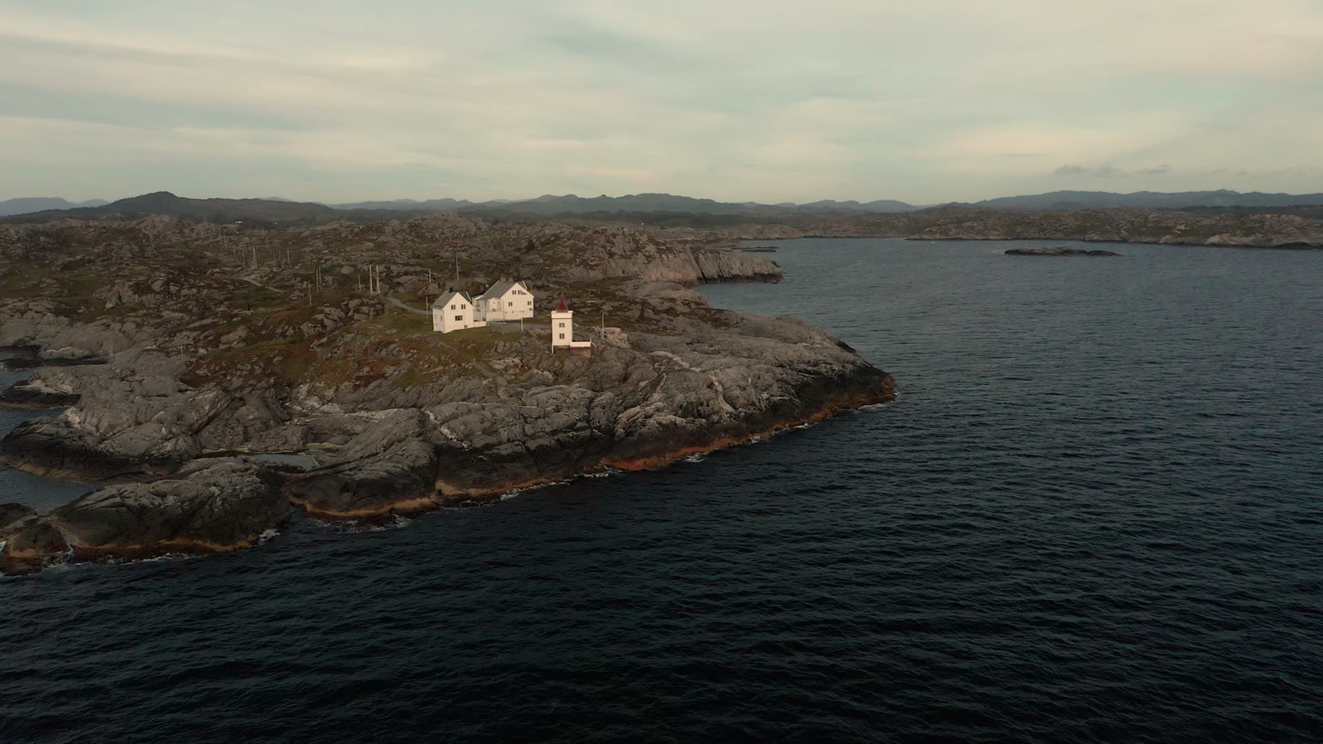 White houses on remote rocky island, Ryvarden fyr