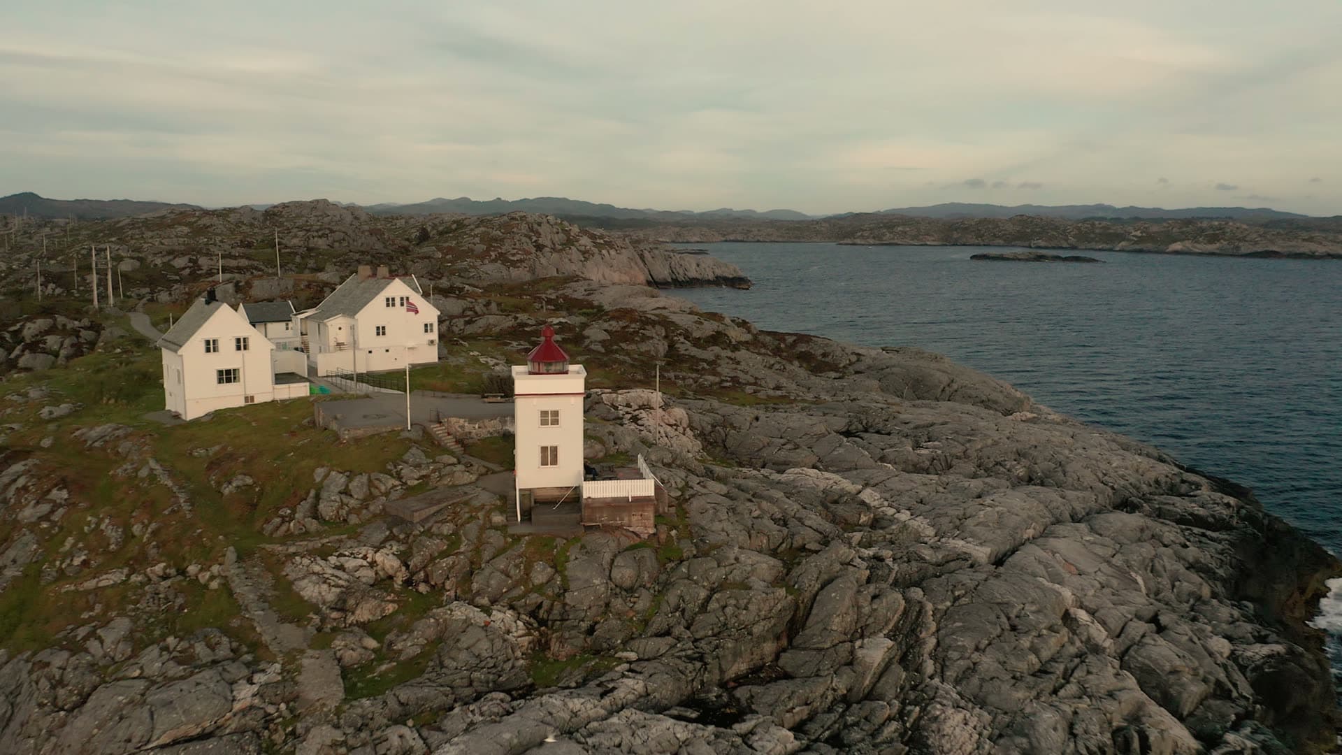 Lighthouse on rocky coastal headland, Ryvarden fyr