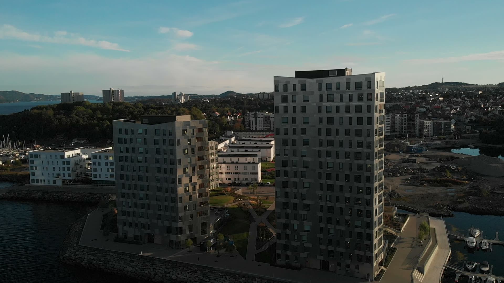 Modern waterfront apartment buildings at sunset, Lervig