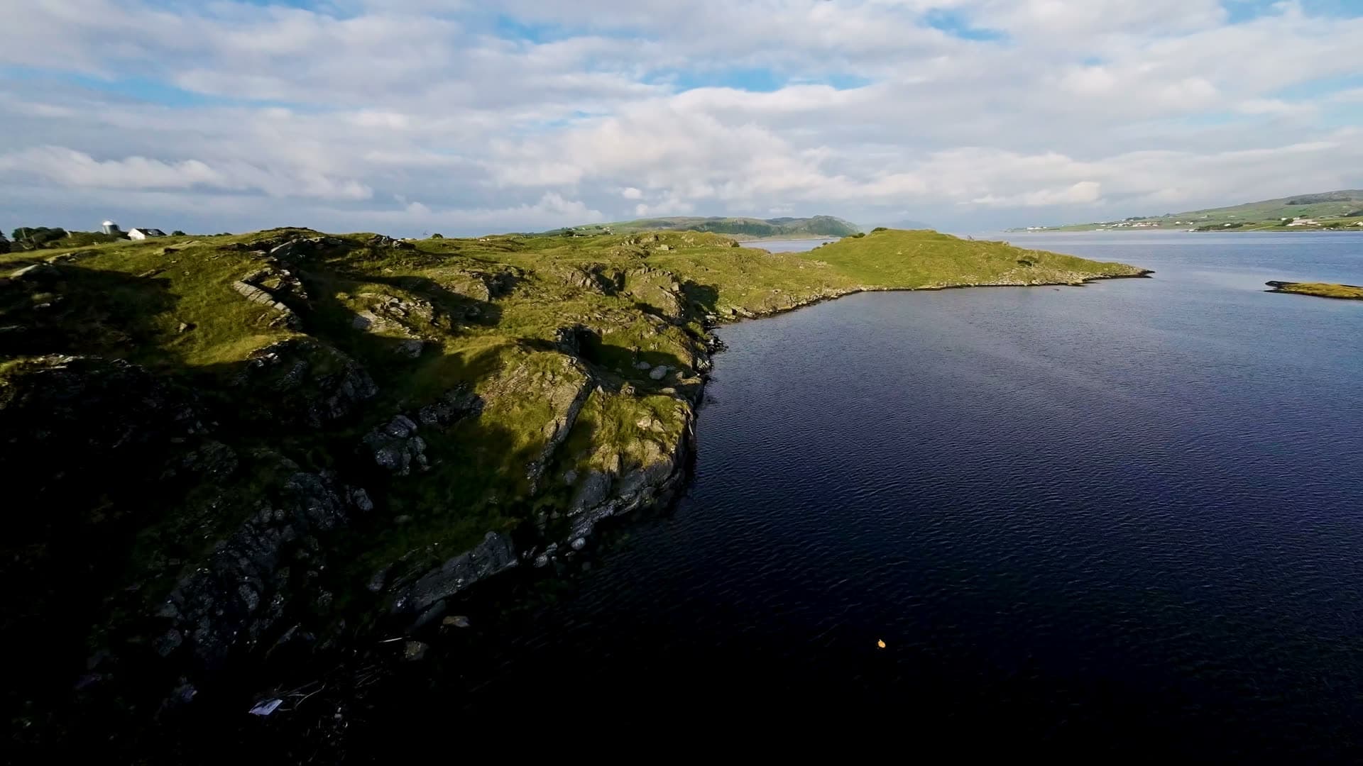 Remote coastal headland with house and fjord, Fjøløy Fortress
