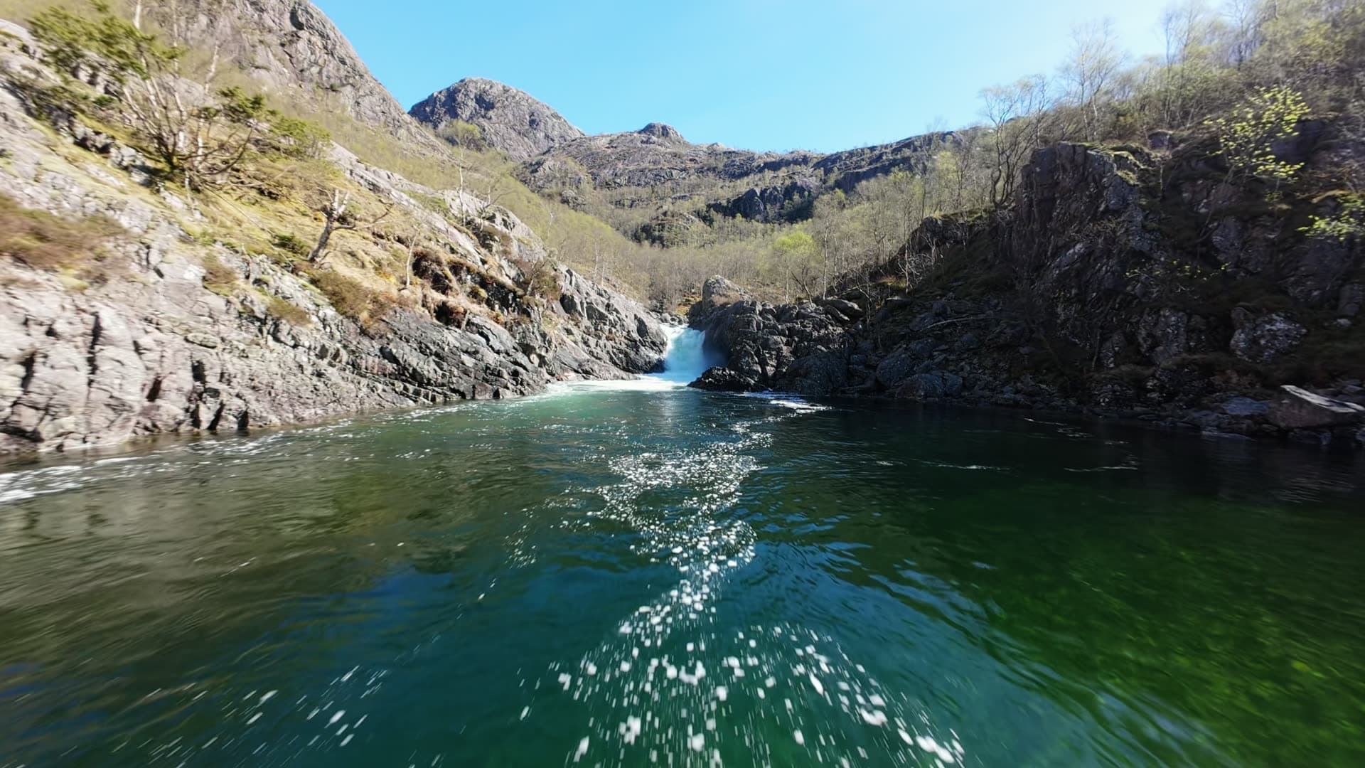 Mountain river flowing through alpine valley, Månafossen