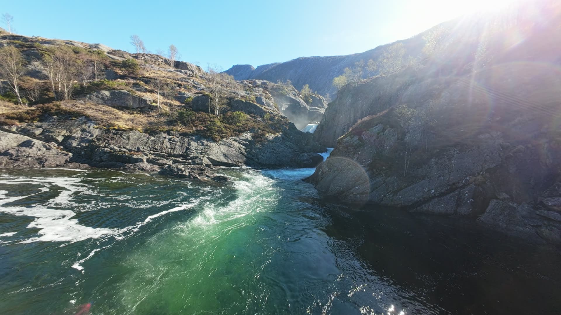 Mountain waterfall in rocky canyon, Månafossen