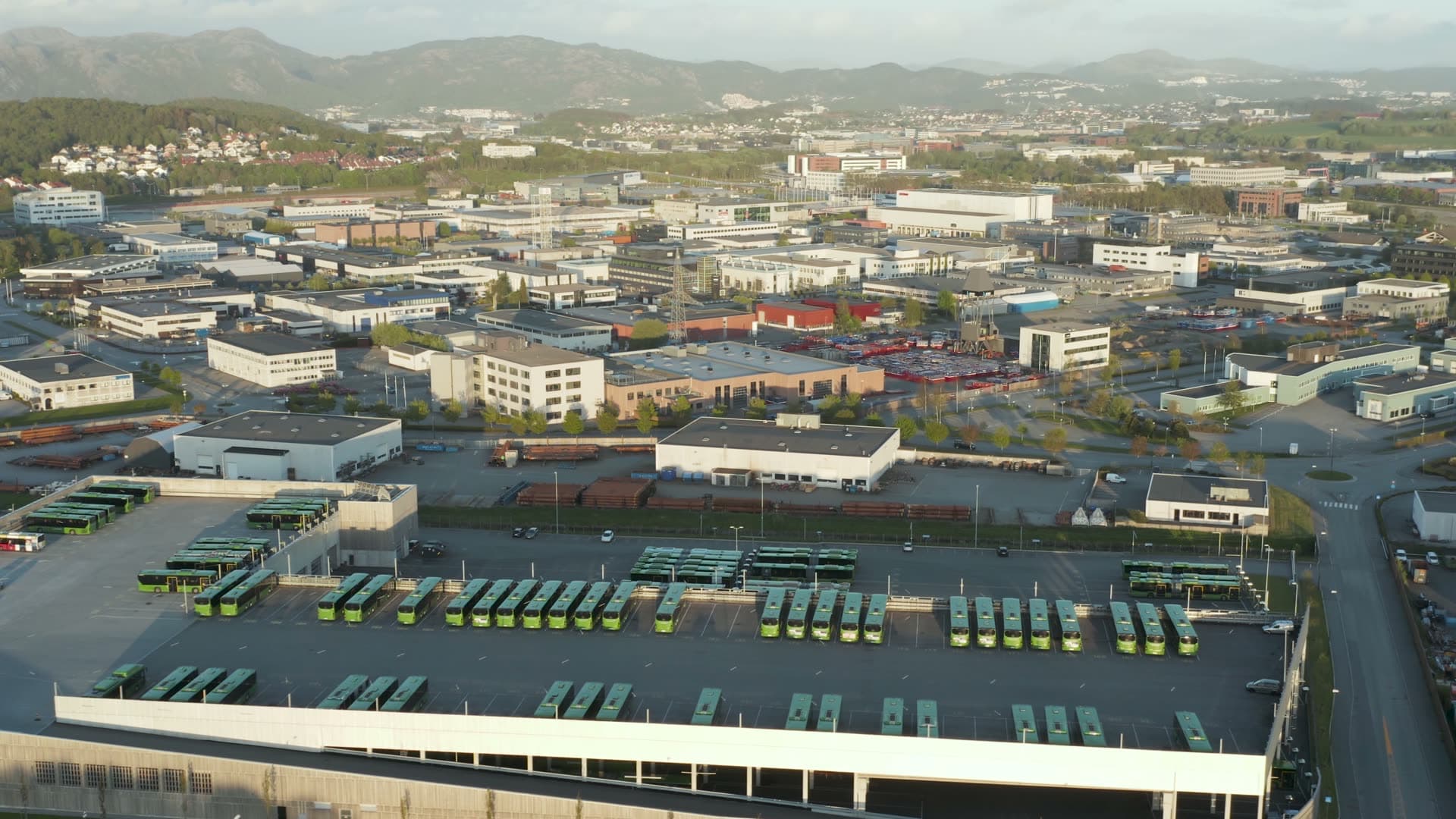Kolumbus Bus fleet depot with mountain backdrop, Moseid