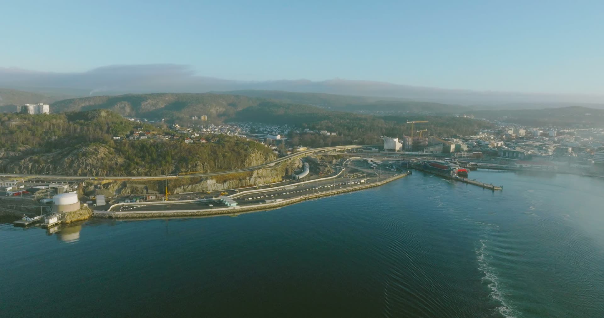 Curved harbor road and commercial port infrastructure, Kristiansand, Norway
