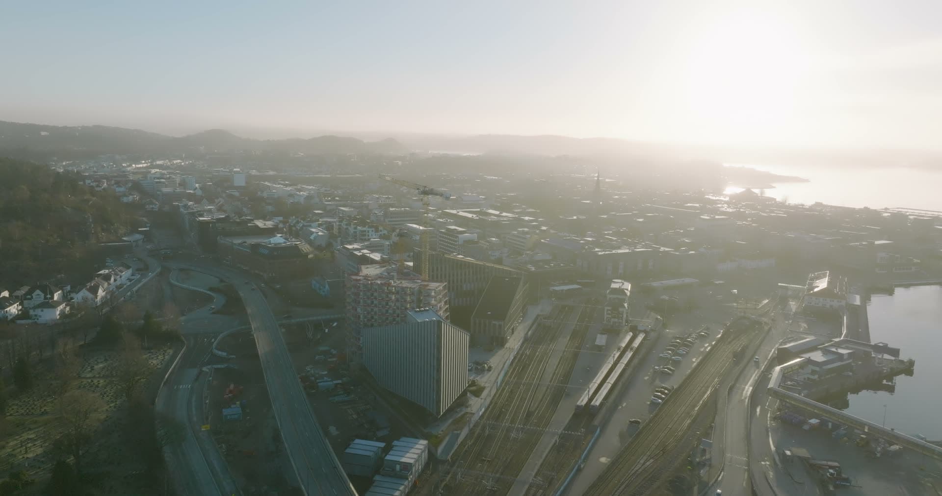 Industrial rail yard shrouded in morning mist, Kristiansand, Norway