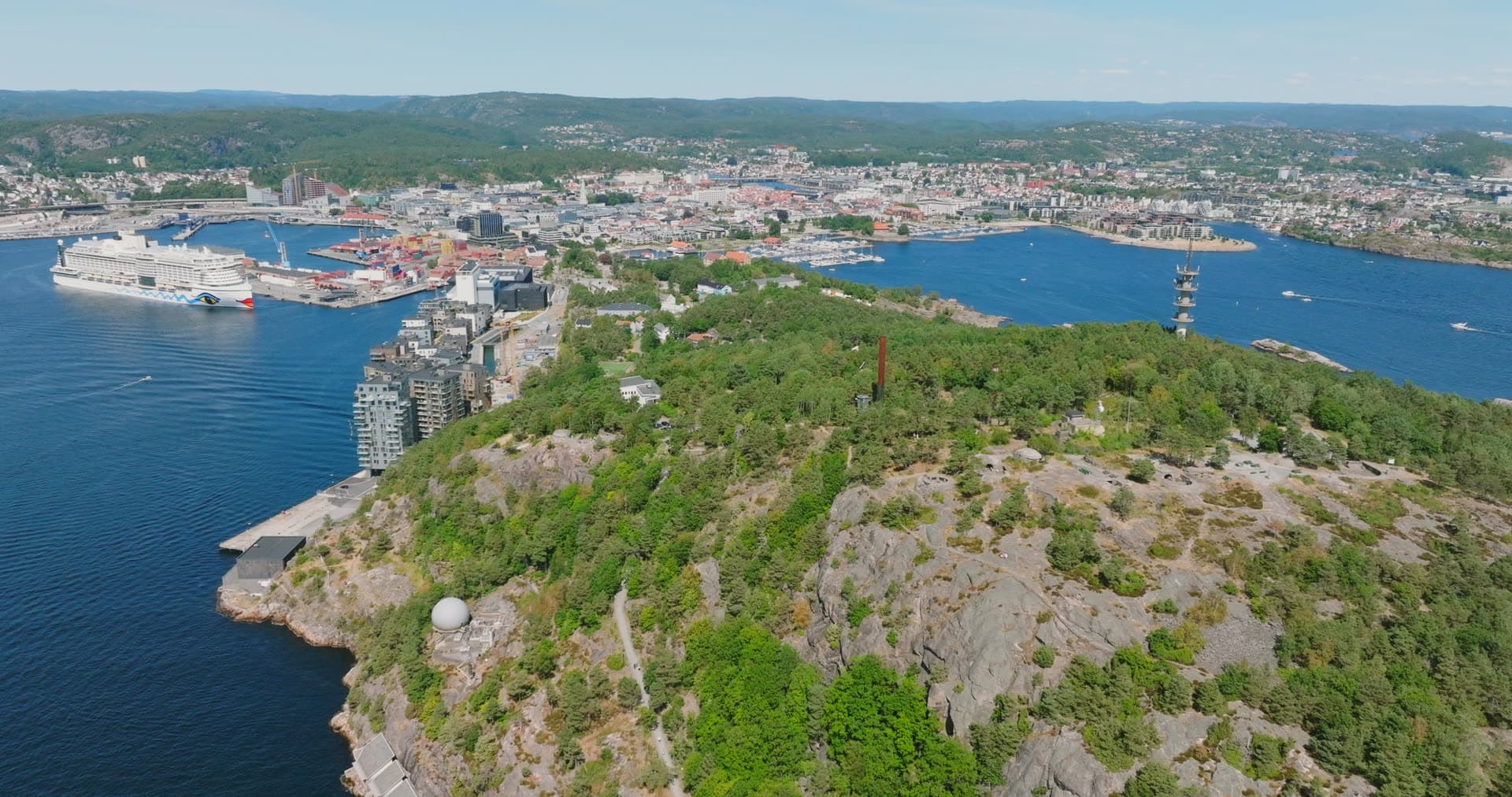 Forested headland with exposed bedrock above port, Kristiansand, Norway