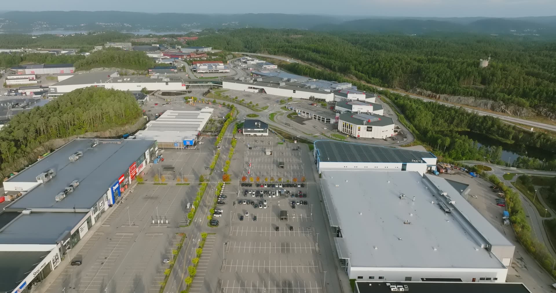 Parking lot central perspective with surrounding retail structures, Sørlandsparken, Kristiansand, Norway