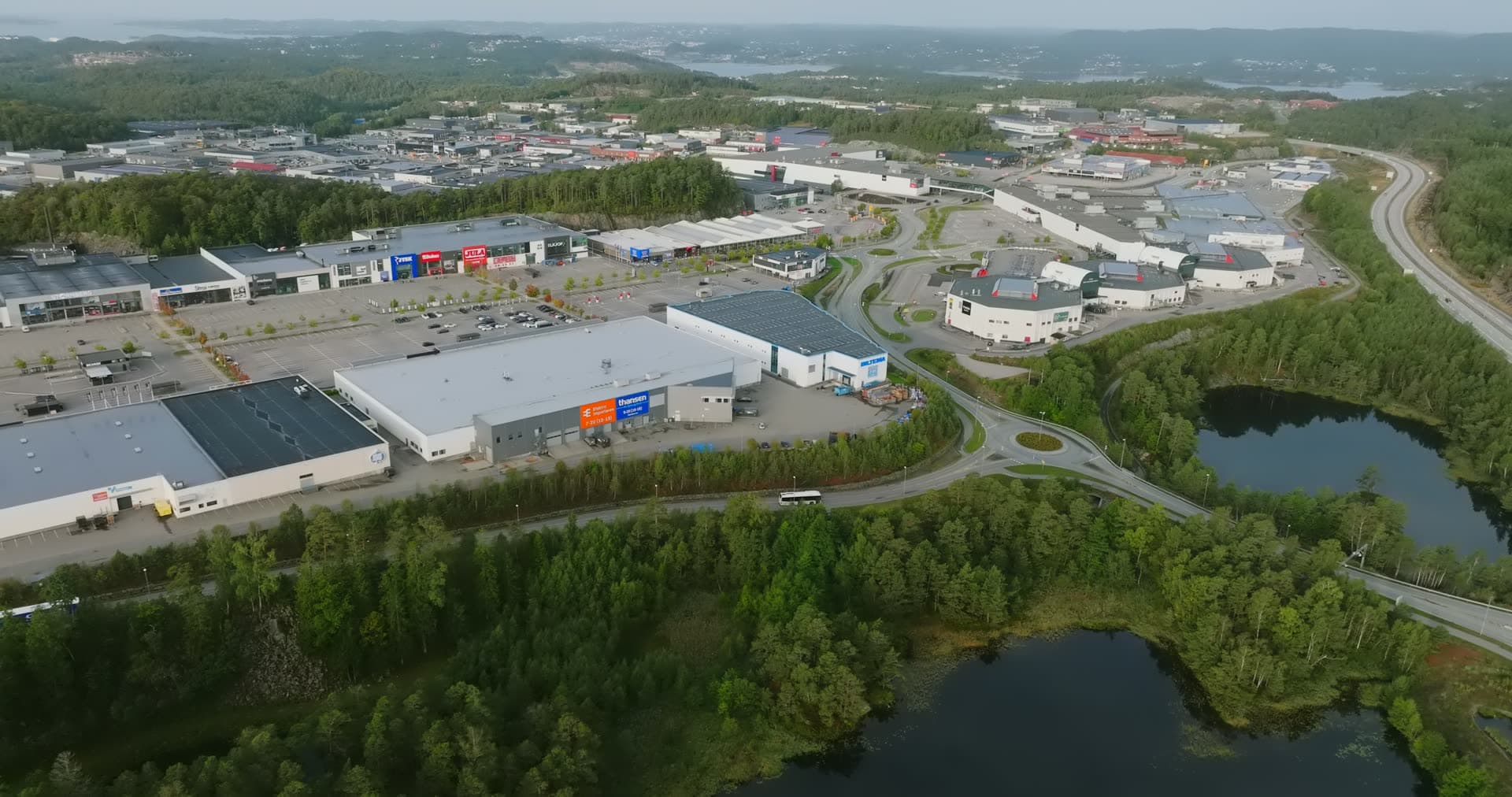 Warehouse district bordered by two forest ponds, Sørlandsparken, Kristiansand, Norway