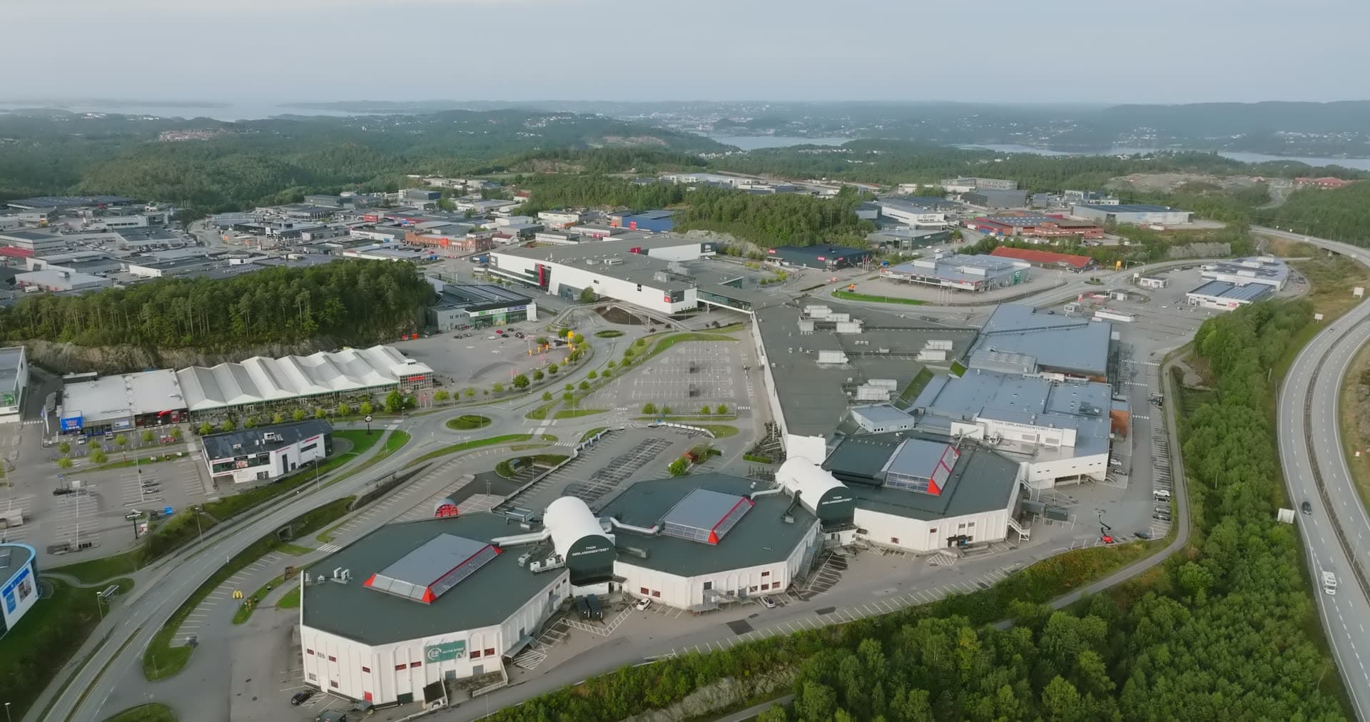 Multiple distinctive curved-roof arena structures grouped together, Sørlandsparken, Kristiansand, Norway