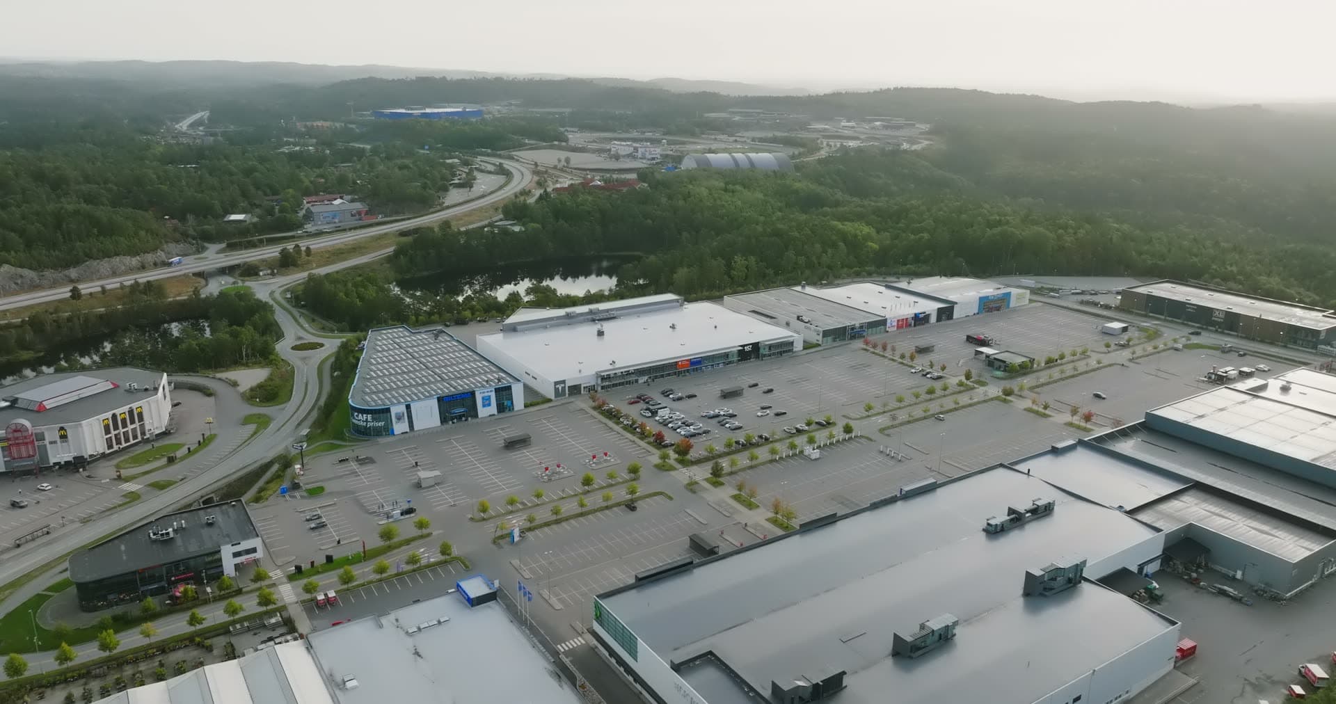 Shopping center parking lots and warehouses from above, Sørlandsparken, Kristiansand, Norway