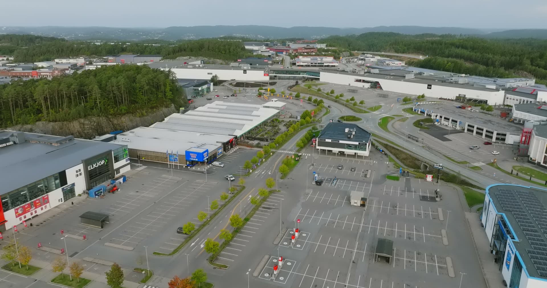 Large warehouse and parking area with organized landscaping, Sørlandsparken, Kristiansand, Norway